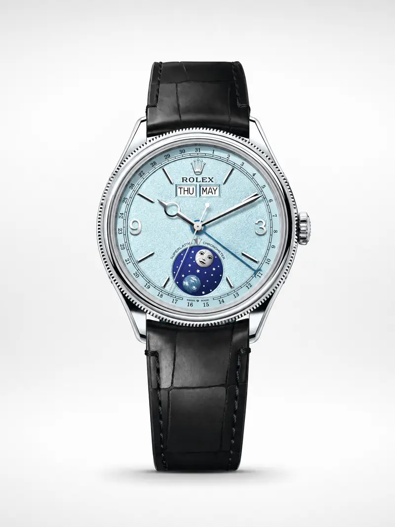 Rolex Perpetual Padellone in platinum with an ice-blue dial on a black leather strap, front view